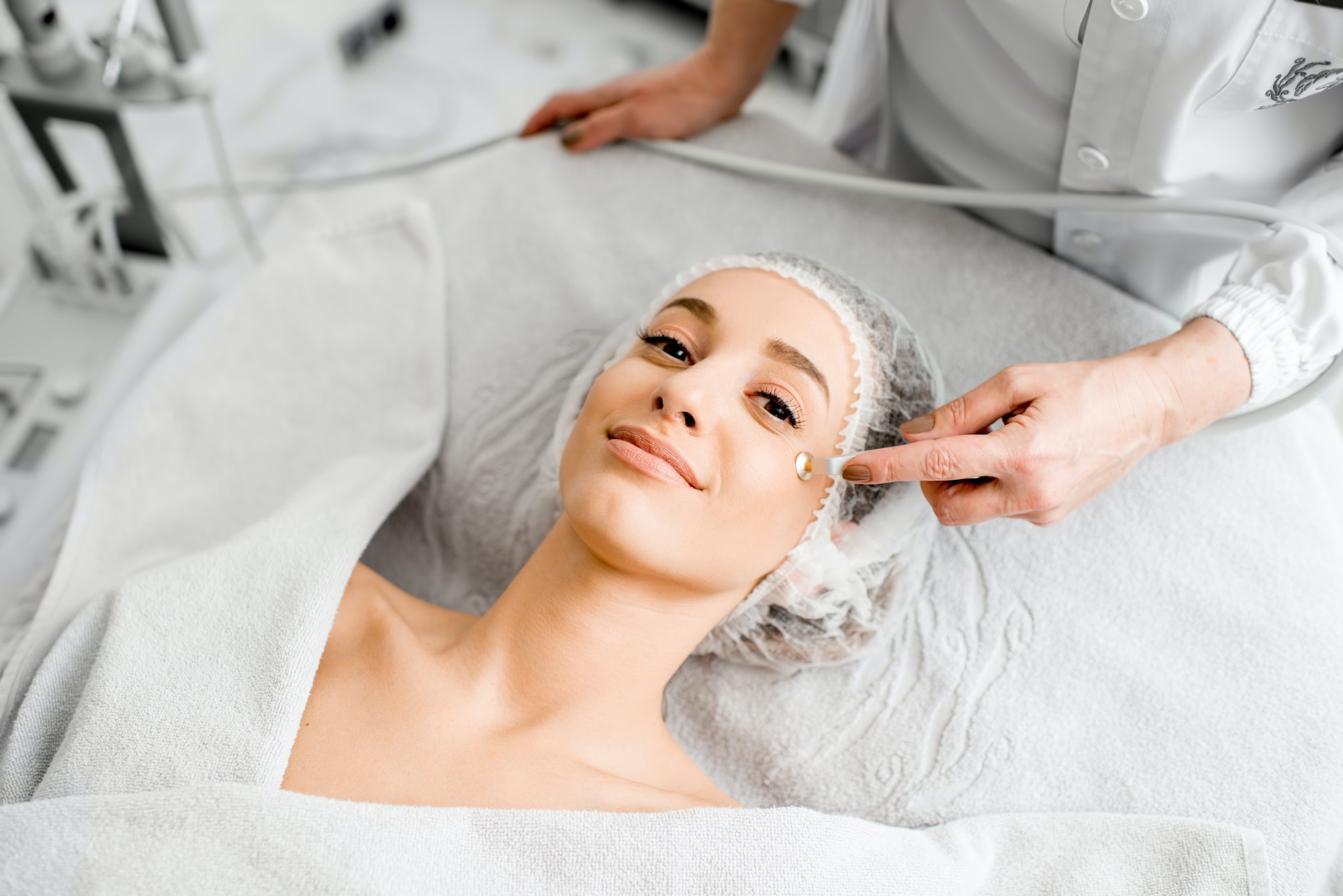 Woman during the facial treatment procedure